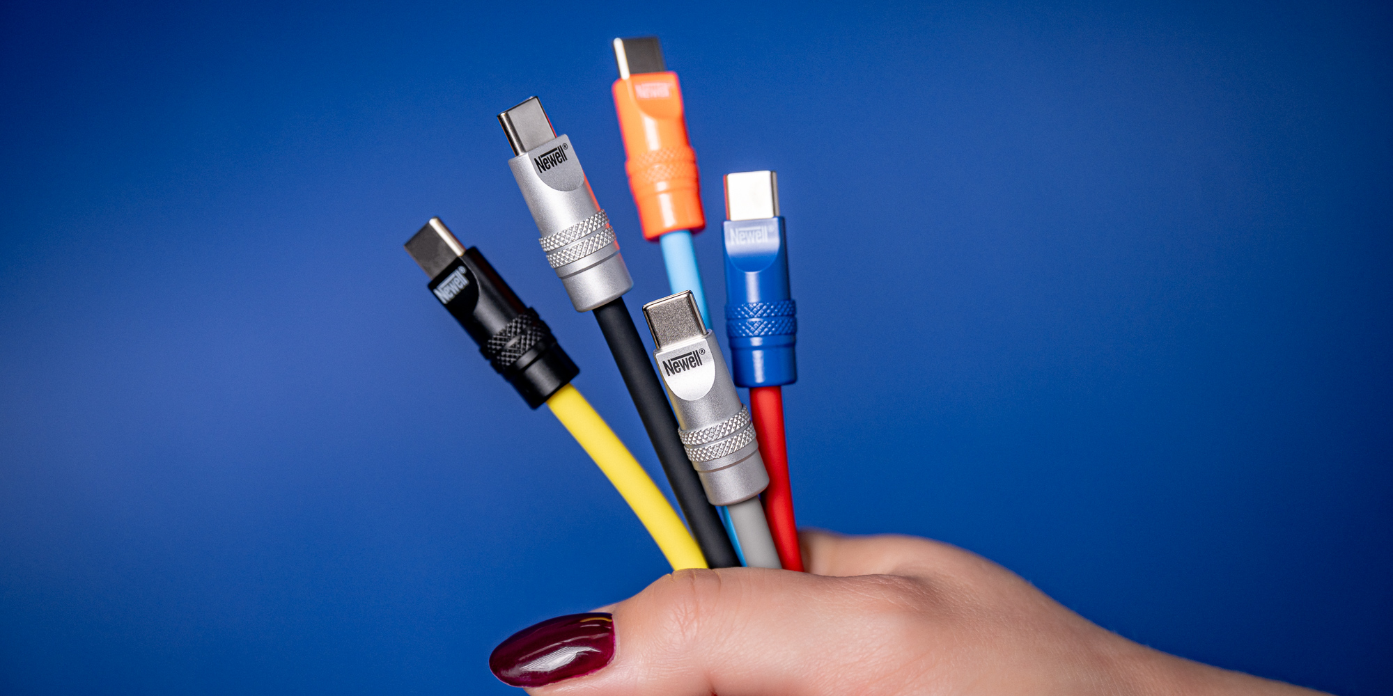 Kabel Newell USB-C - USB-C 100 W, 1,5 m, silikonowy, spiralny, żółto-czarny